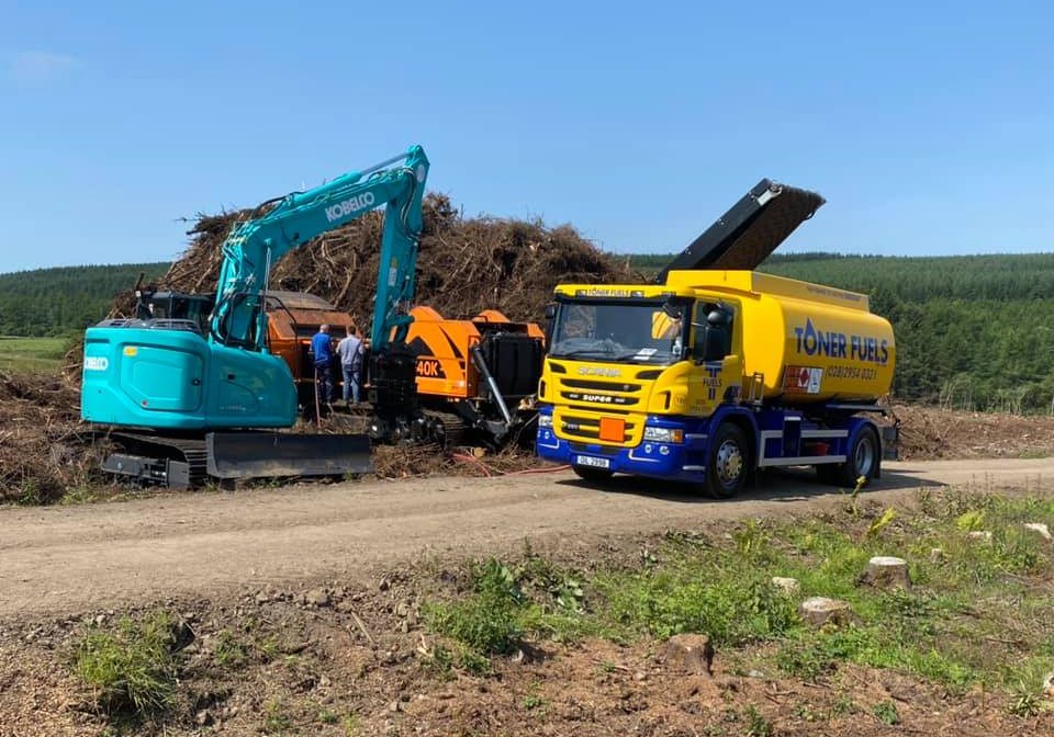 Toner fuels truck refuelling jcb