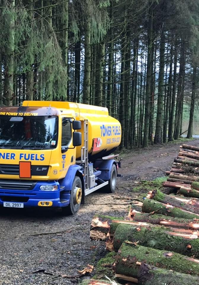 Toner fuels truck parked in forest