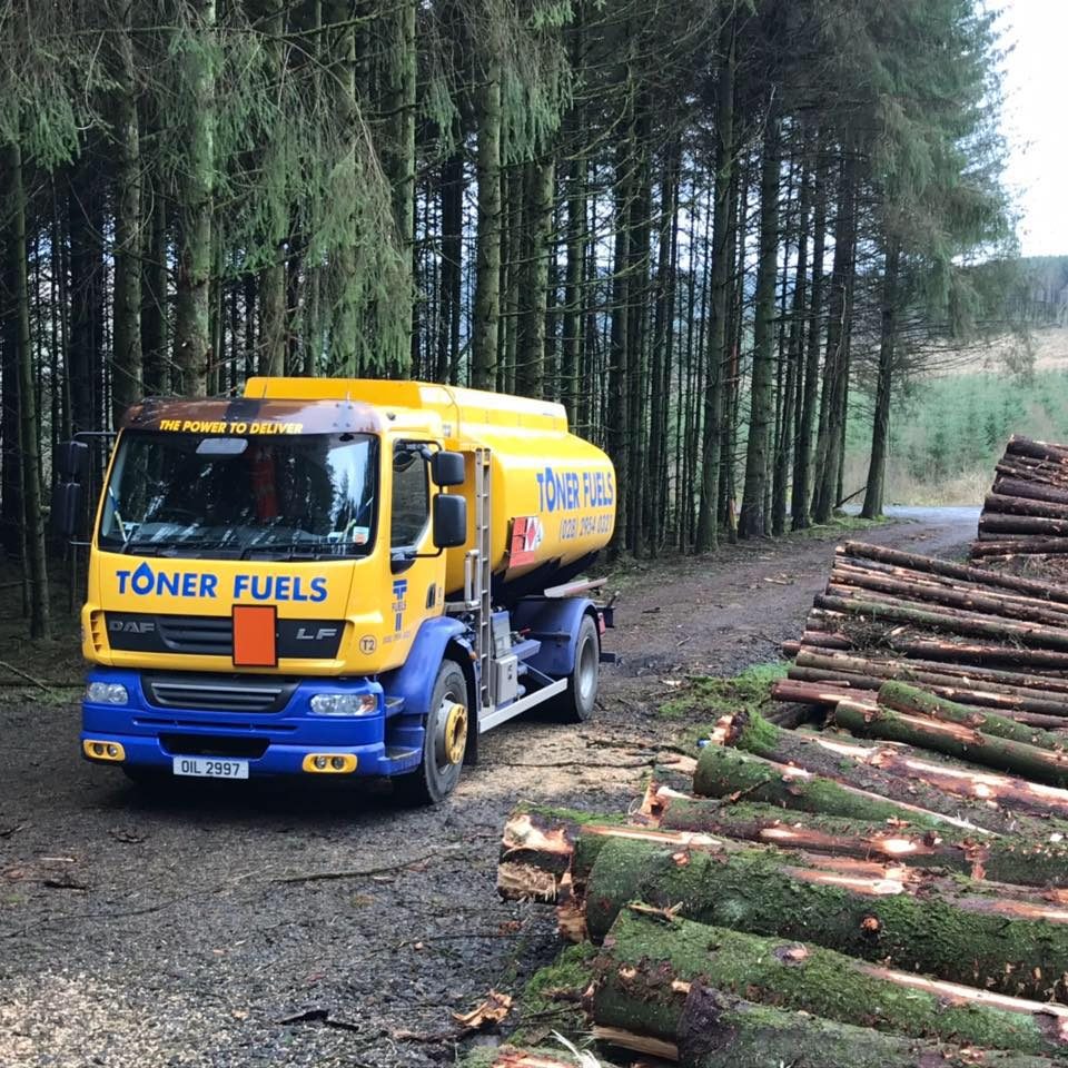 Toner fuels truck parked in forest