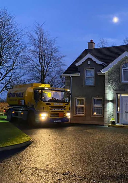 Toner fuels truck at family home at night